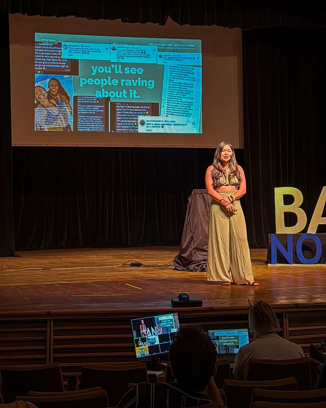 Marie presenting on stage